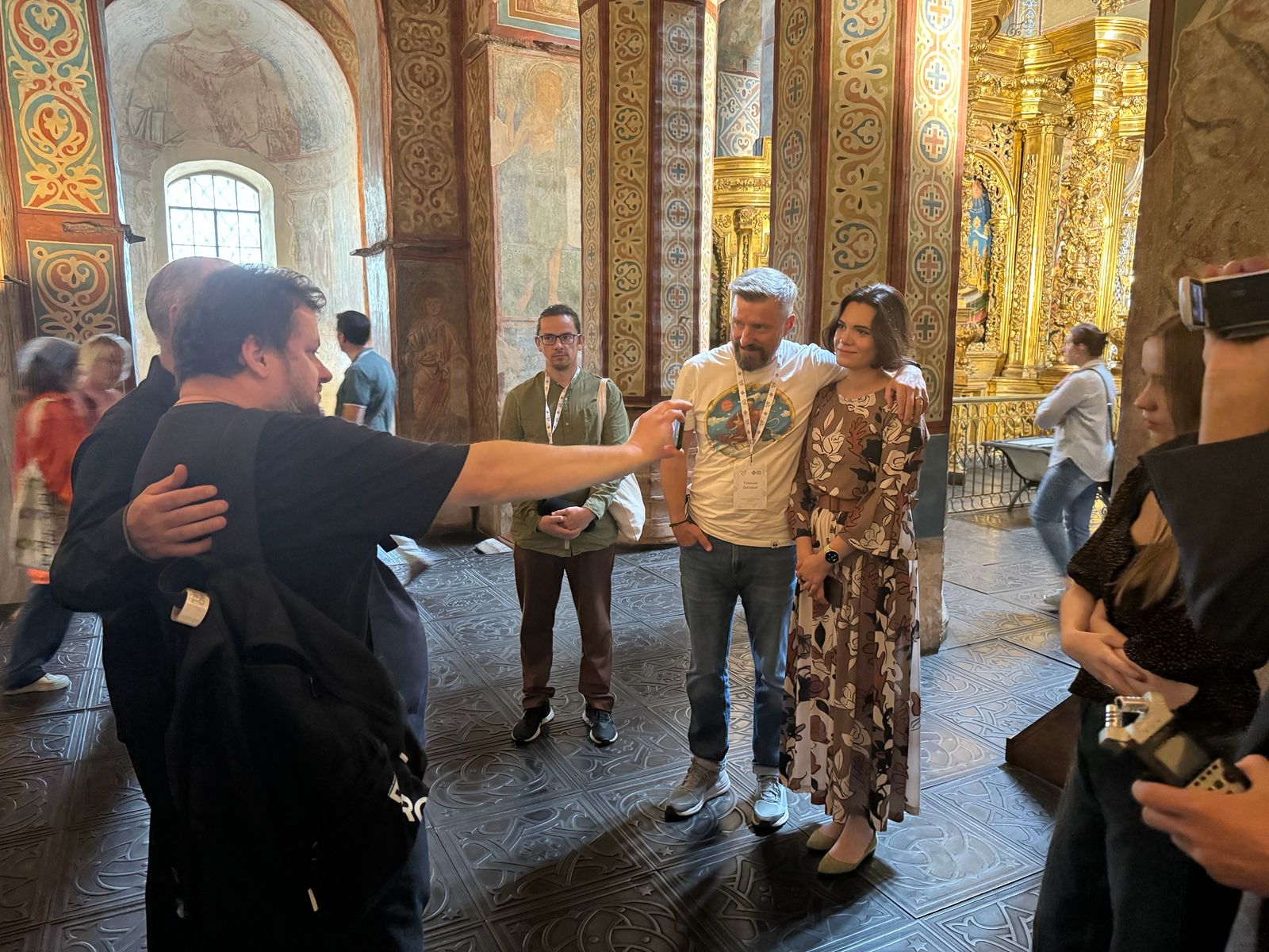 Participants embrace inside St Sophia Cathedral