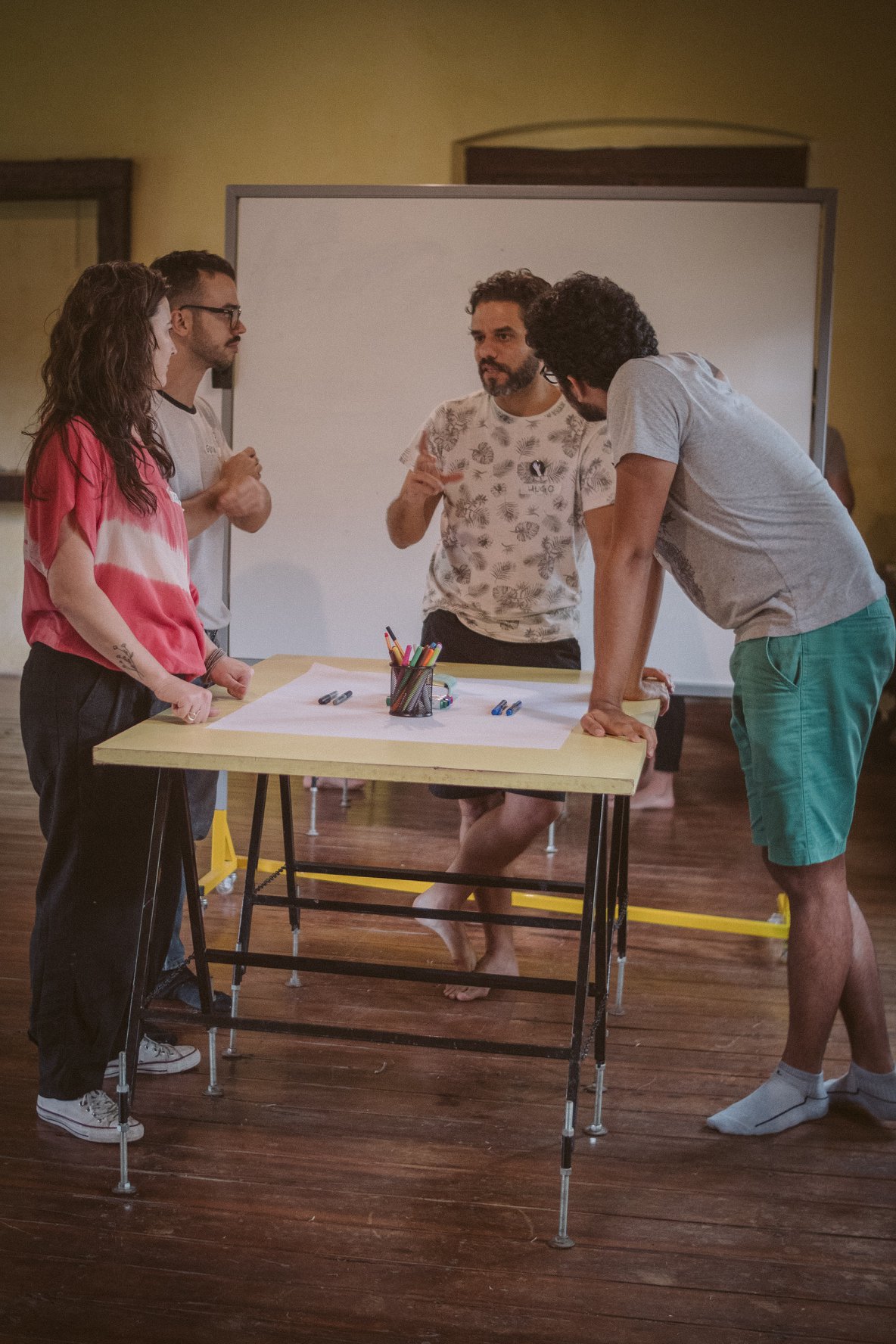 A small group working together at a table